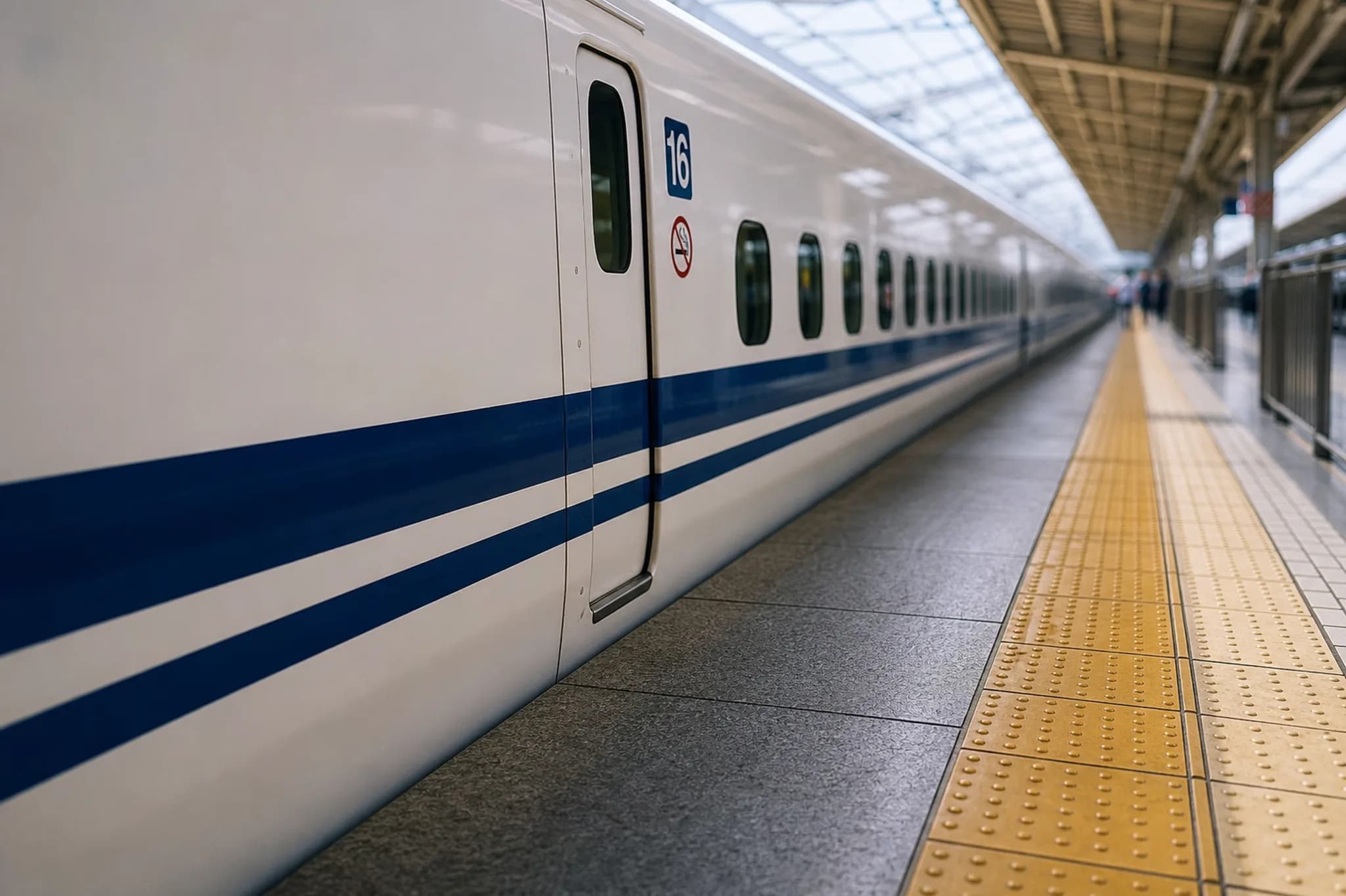 Shinkansen N700 along a platform with yellow tactile paving